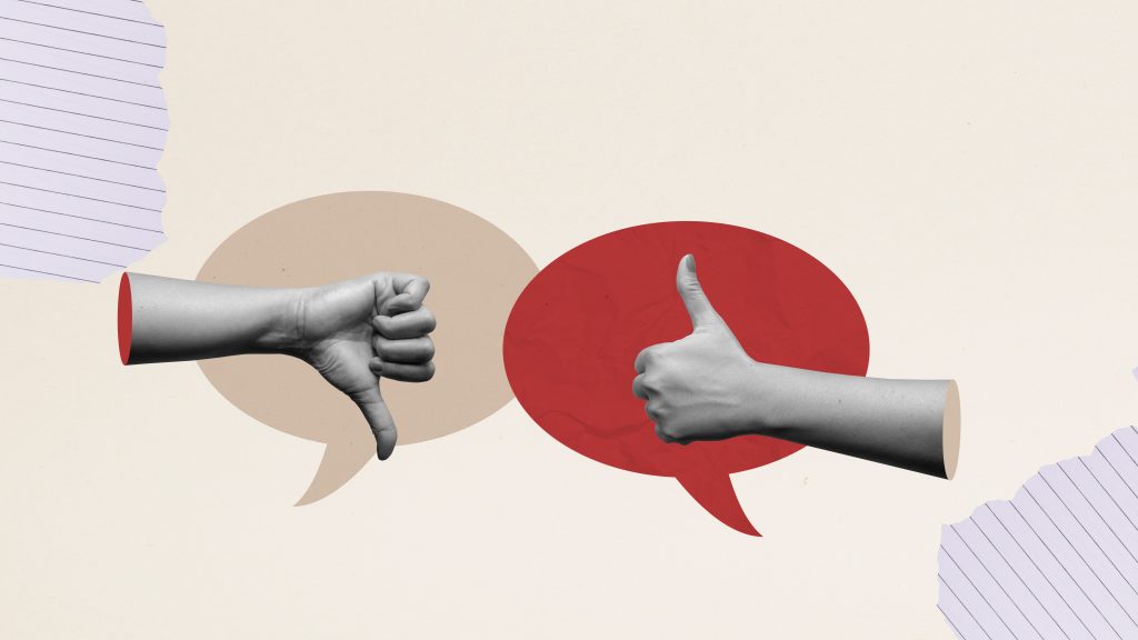 Closeup view of human hands with thumb up and down gestures on a colored background